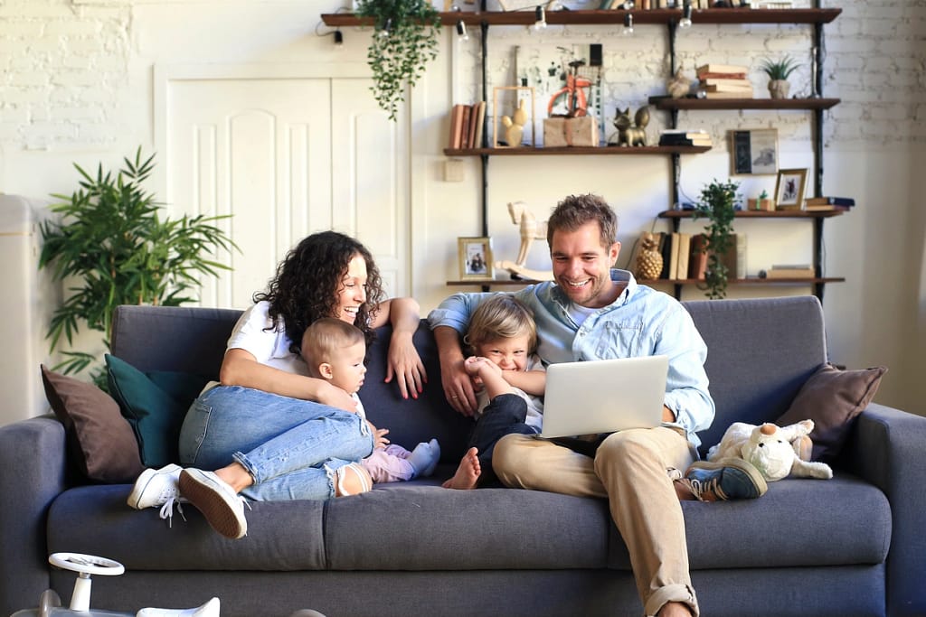 happy family spending time together on the couch