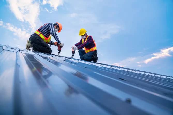 commercial roof building by workers