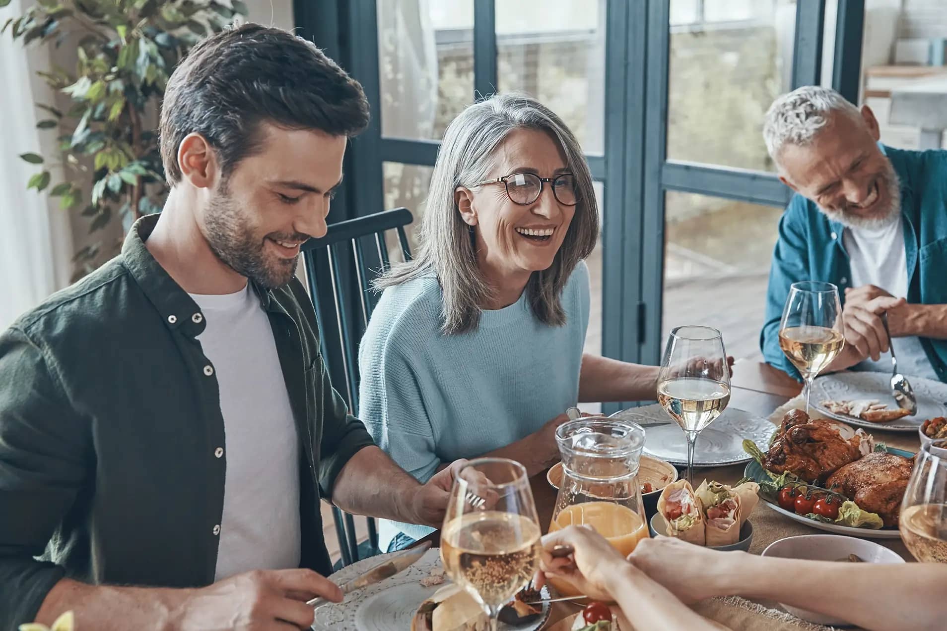 Happy family sitting down for dinner