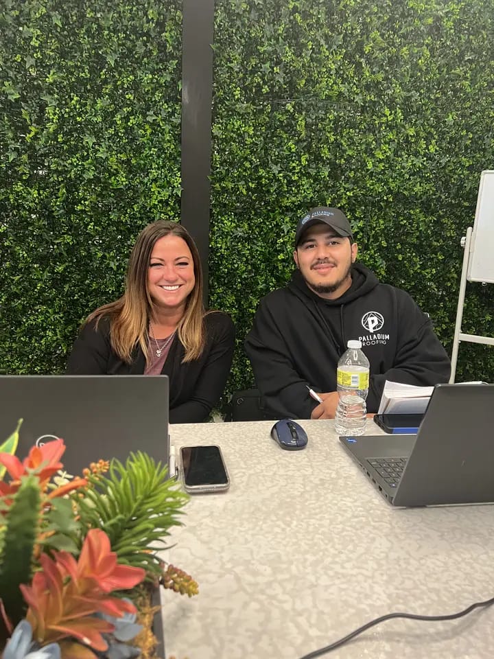 team members working with laptops at the office