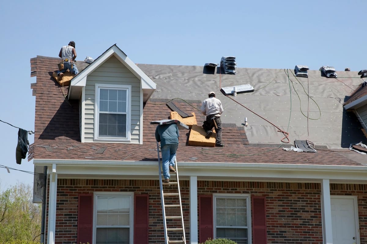 roof replacement on storm damaged house roof