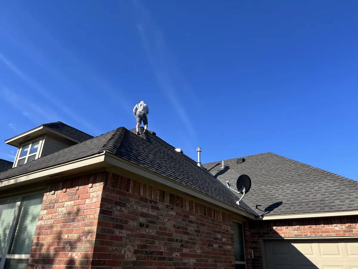 worker on the residential home roof