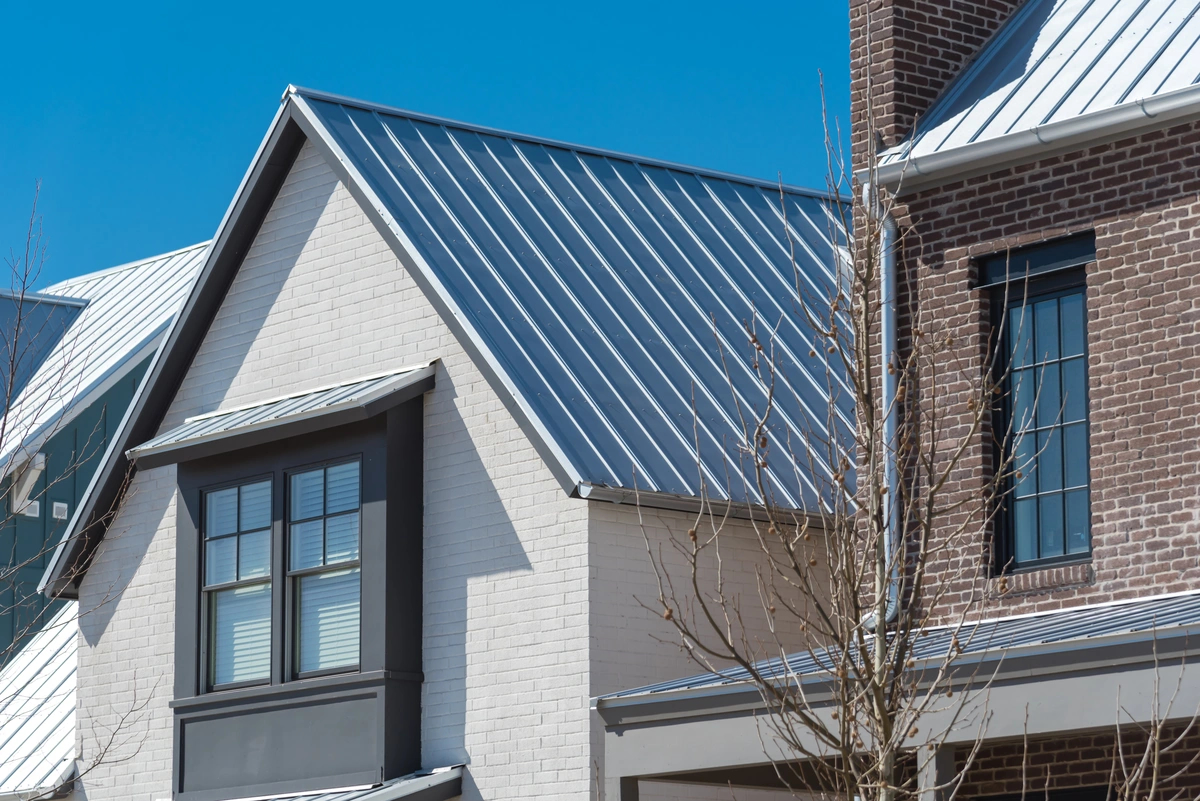 metal roof vs shingles-metal roof on neighborhood house