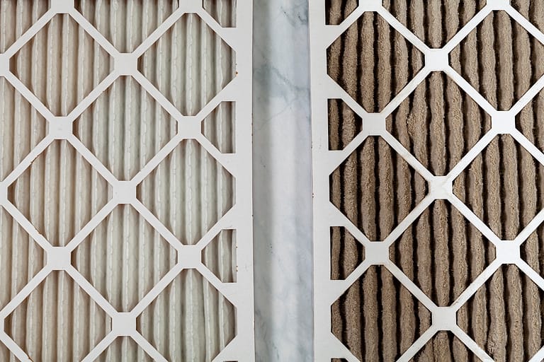 Side by side close up view of a new unused and an old heavily clogged dirty air filters. Image emphasizes the role of framed filters in improving air quality and preventing respiratory problems.