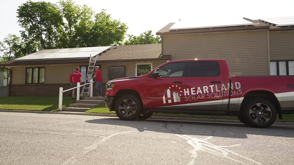 commercial roofing companies in ankeny branded truck parked outside building