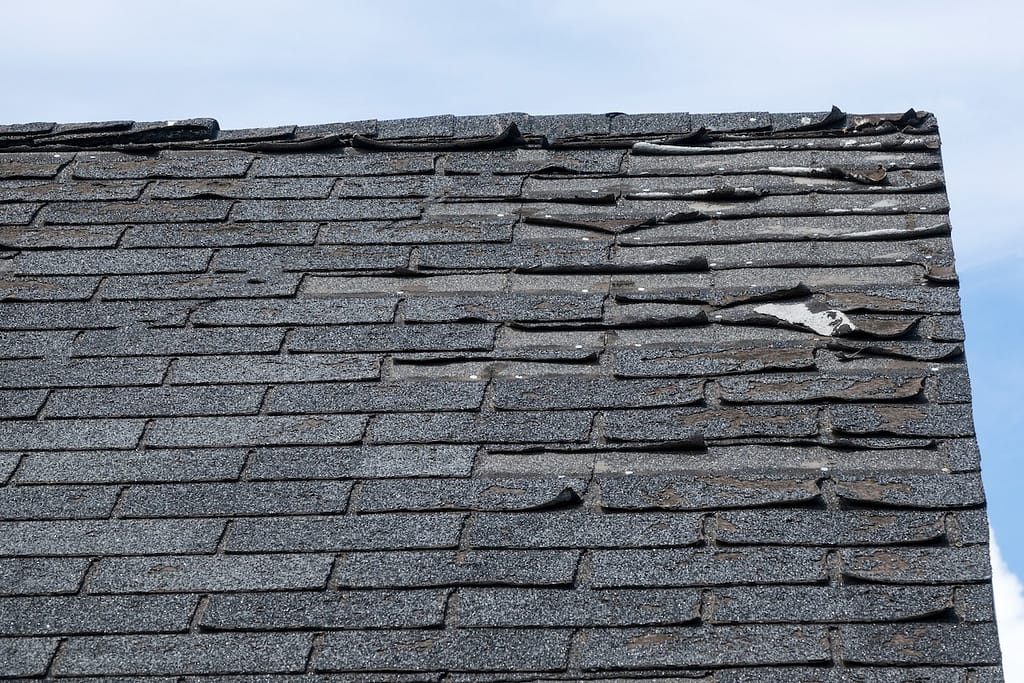 Badly damage roof shingles