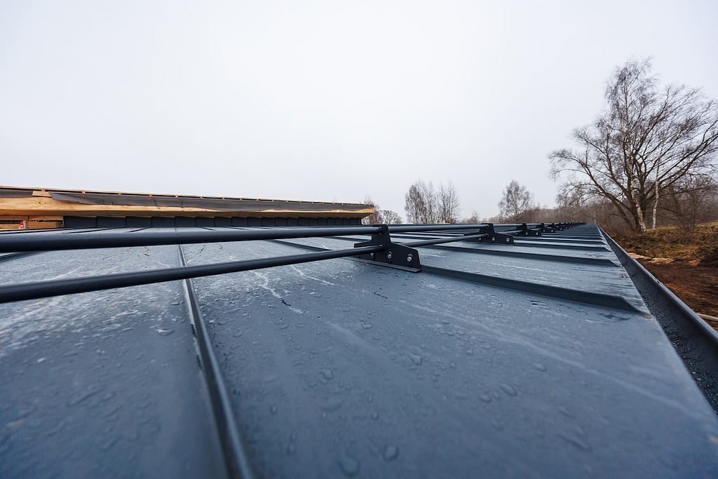 seam metal roof with continuous snow guards