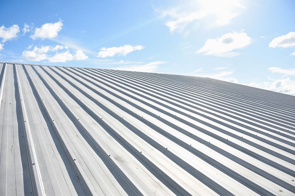 metal sheet roofing on commercial construction with blue sky