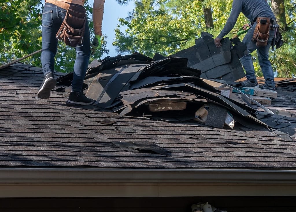 removing damage roofing due to sagging roof