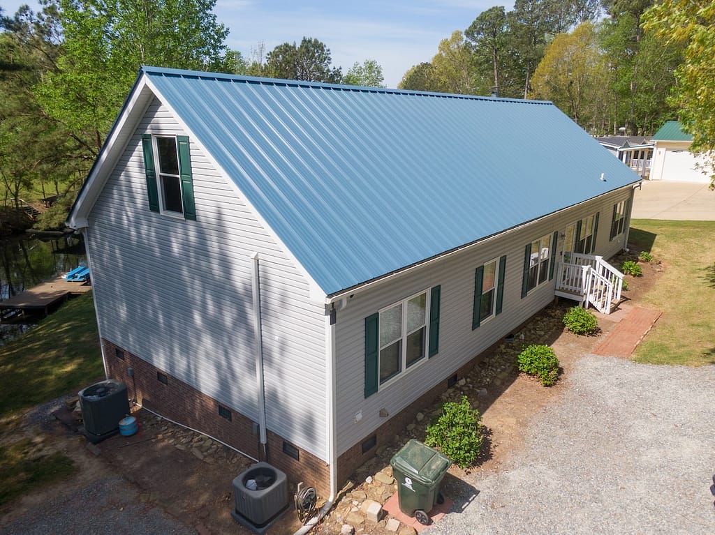 New steel metal light blue roof on a single family home