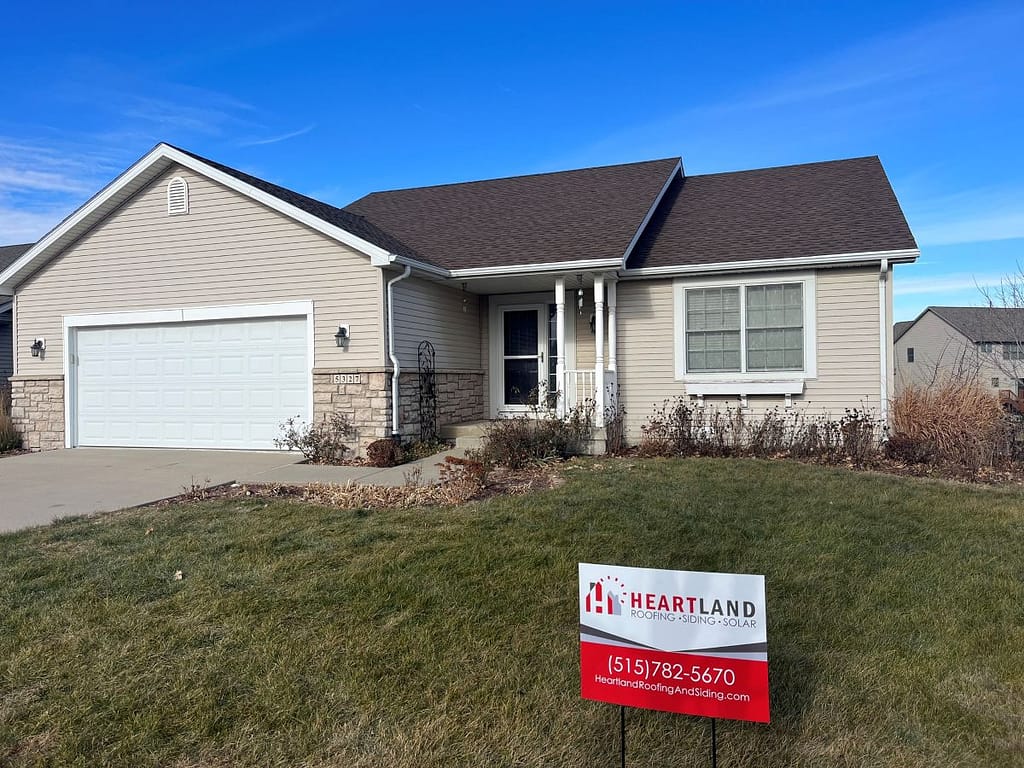 House with newly installed roof by Heartland Roofing
