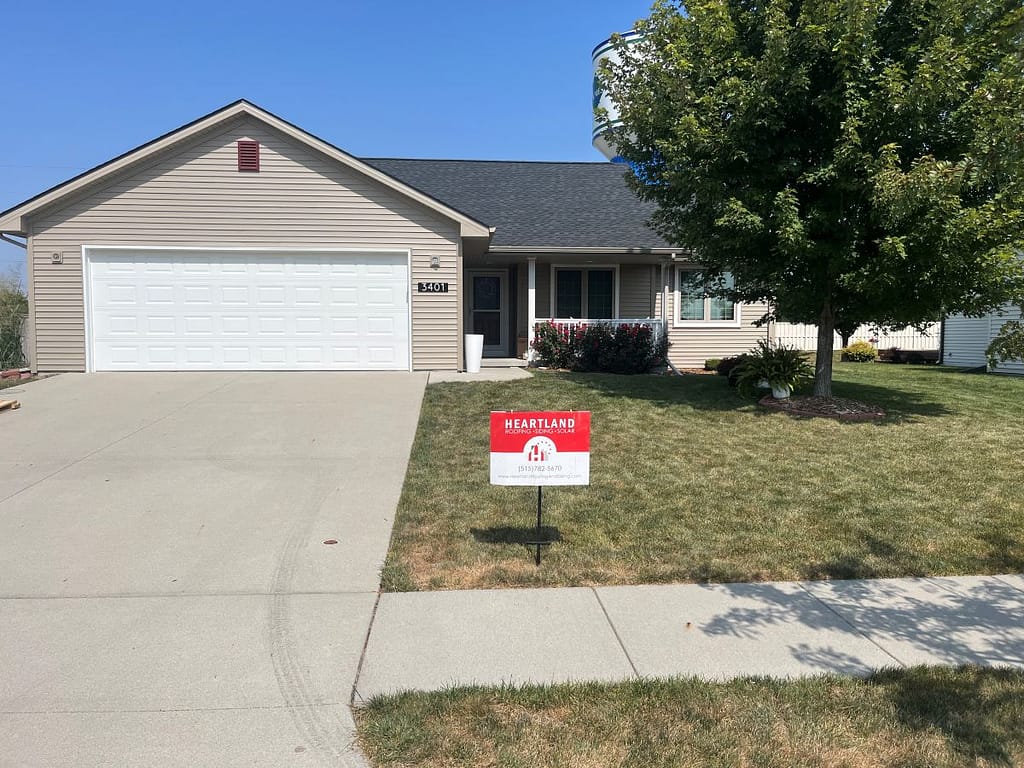 House with newly installed roof by Heartland Roofing