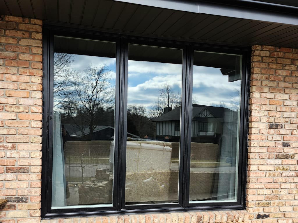 Pella Lifestyle Series replacement windows installed in an Iowa home by Heartland Roofing, Siding, and Solar.