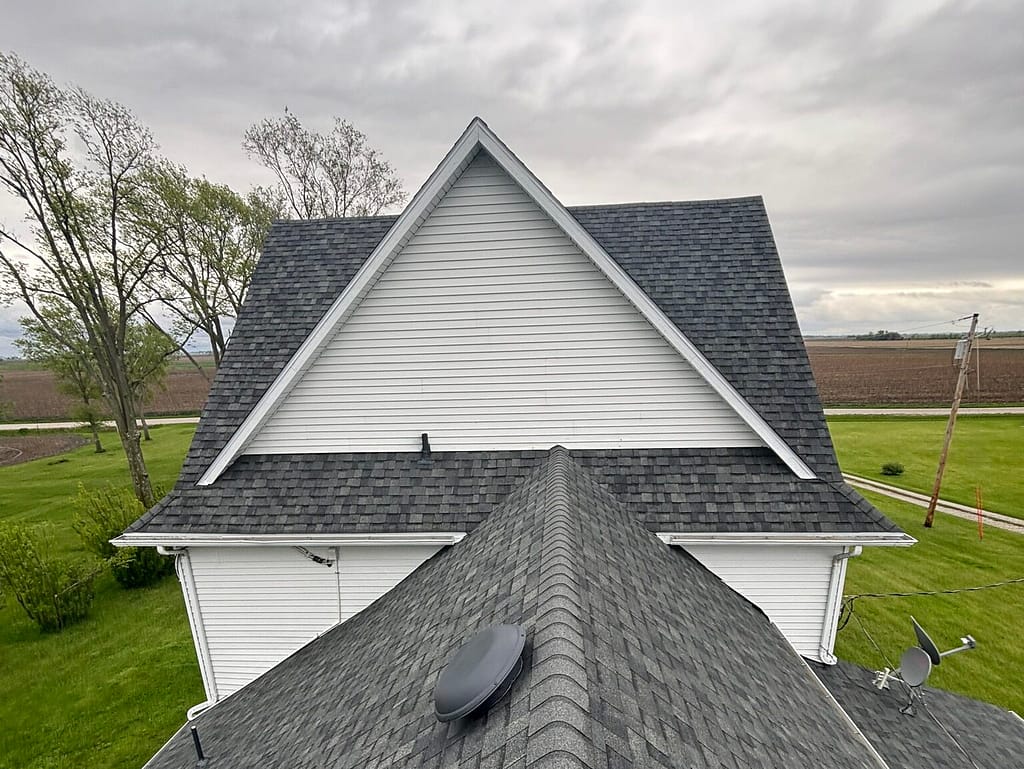 roofing companies in hopkins dark sky white siding house with grey shingles roof