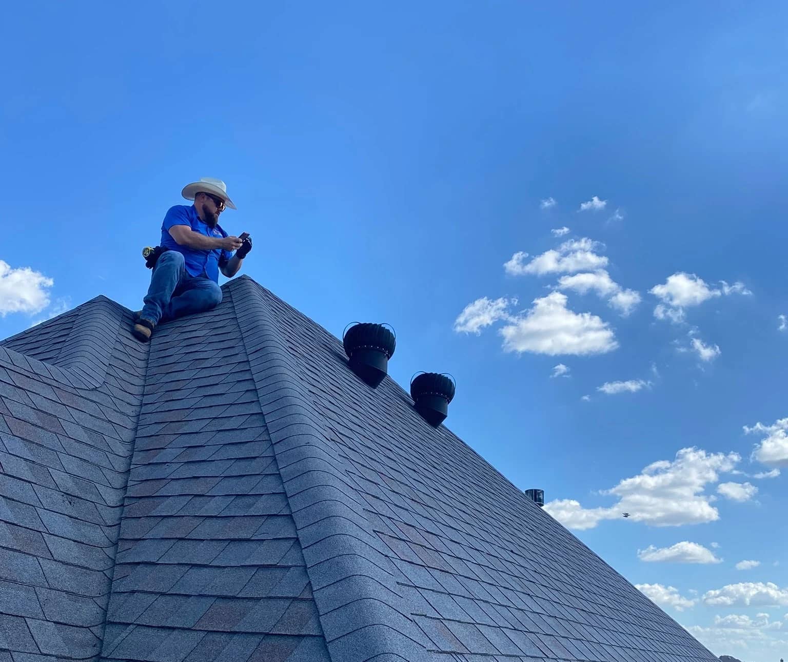 worker on the new roof with ventilation