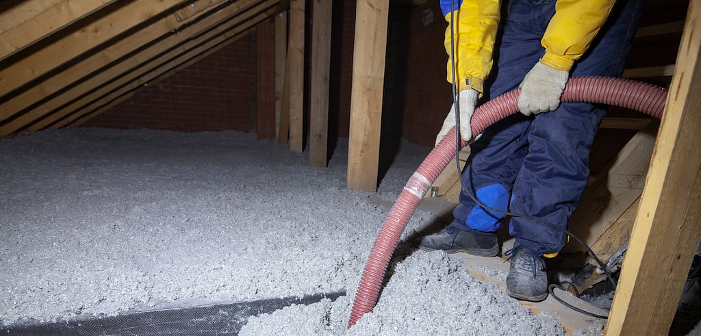 Hiring a Blown-In Insulation Contractor installation in an attic