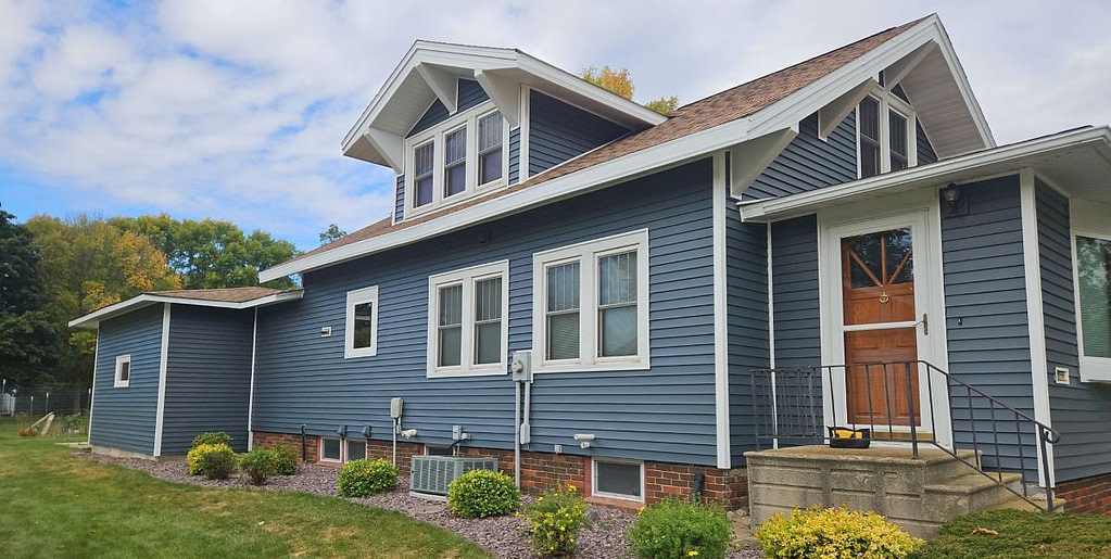 Newly installed blue vinyl siding