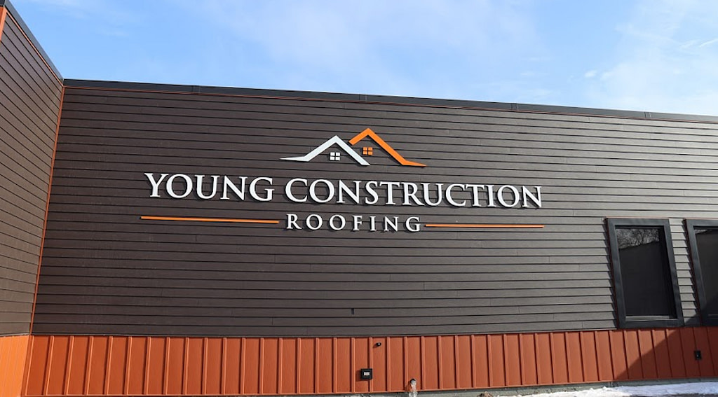 Building with Young Construction Roofing sign