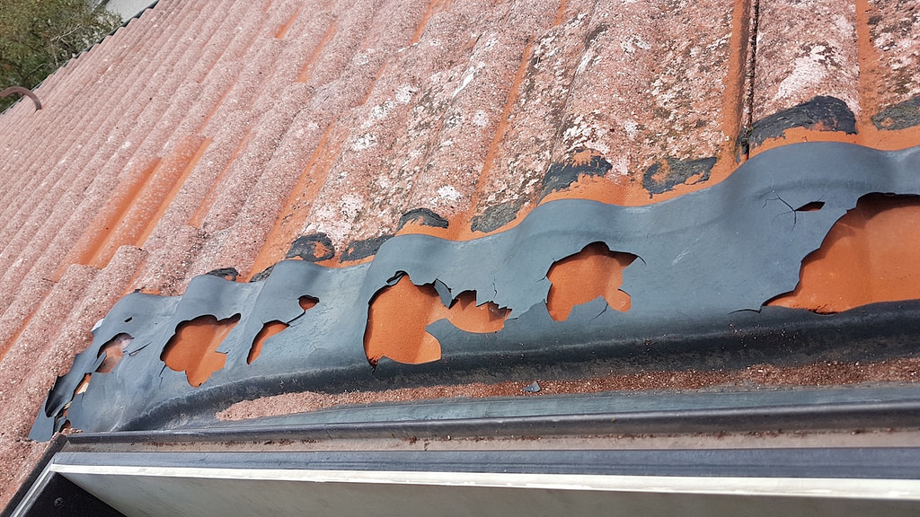 old roof damaged by hail, closeup shot