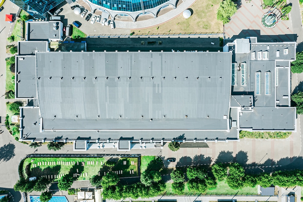 commercial roof of modern building with ventilation systems and skylights. aerial top view