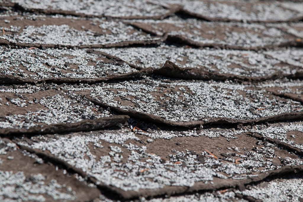 Old worn out shingles starting to curl