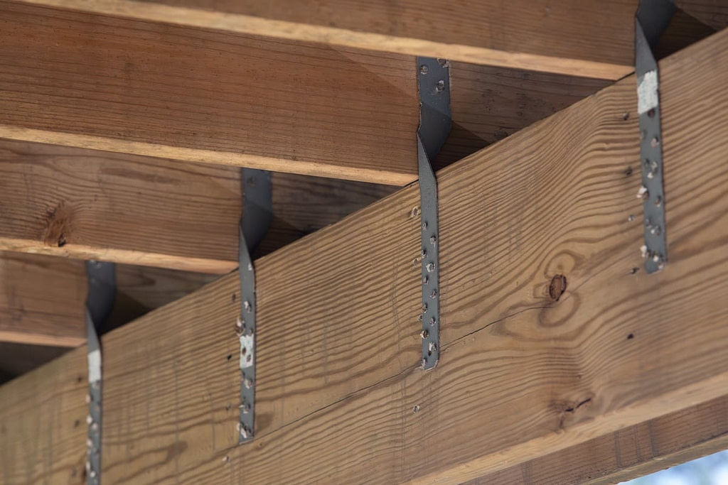Framing hurricane straps under house