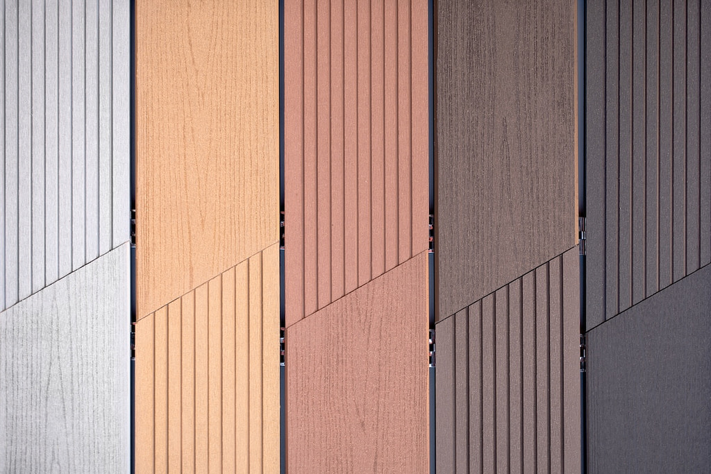 Samples of metal siding with different colors, texture.