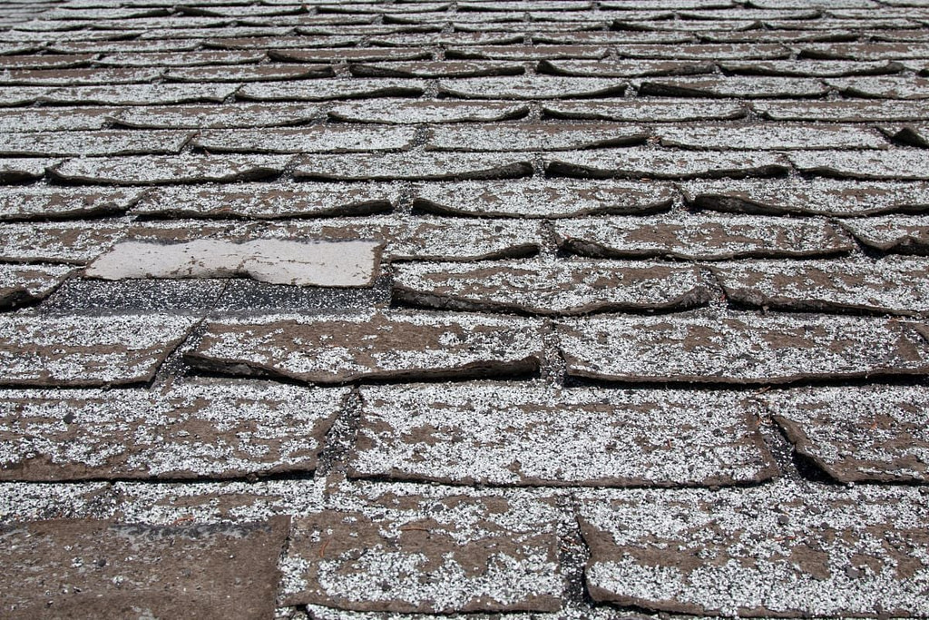 damaged asphalt shingles