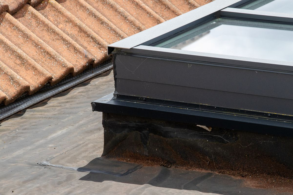 rusty and damaged flashing on a skylight