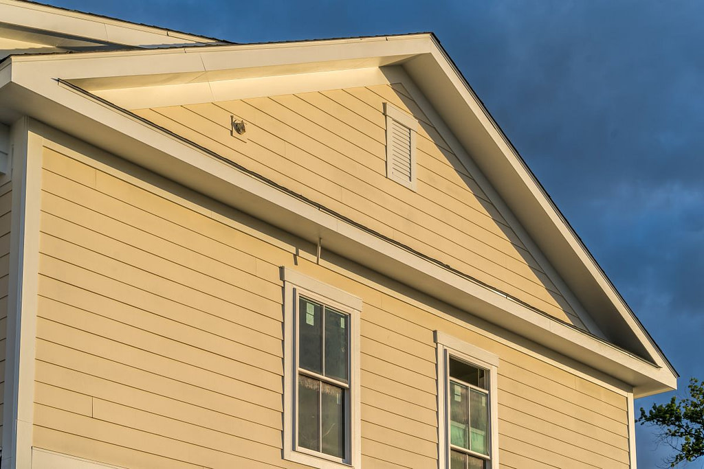 best siding for albert lea mn homes yellow siding white window