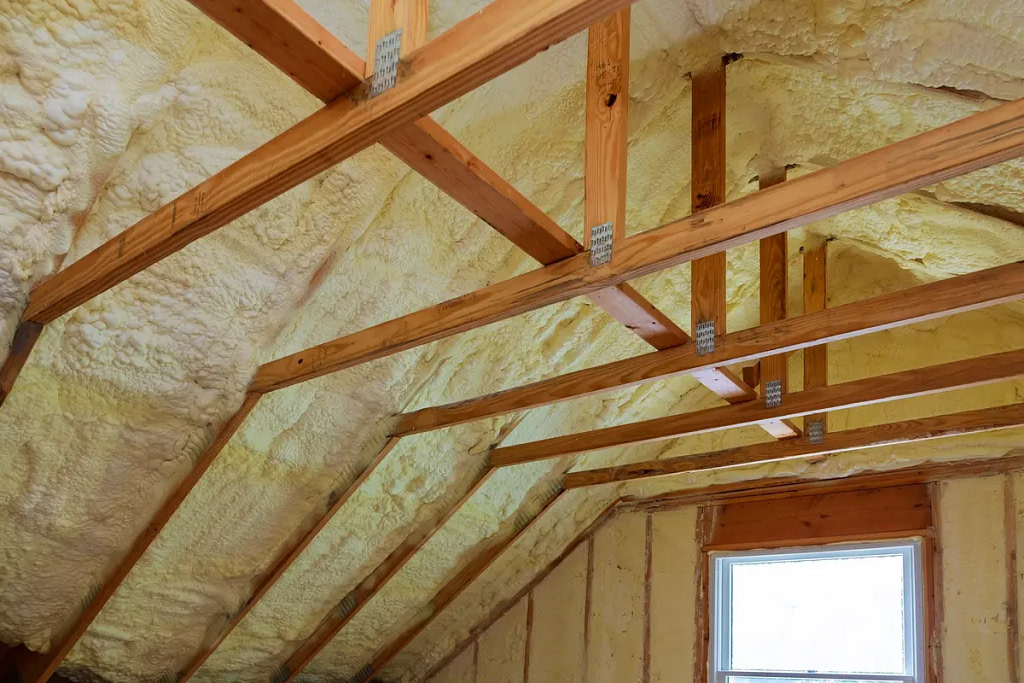 Install Energy-Efficient Insulation with wooden beams visible