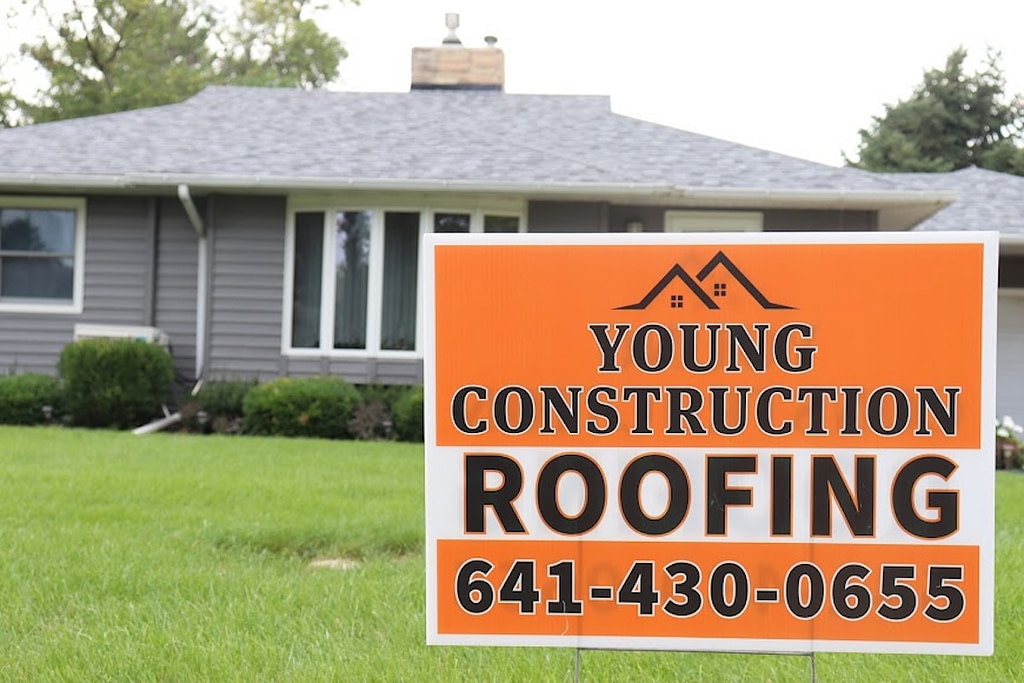 Roofing Young Construction in front yard