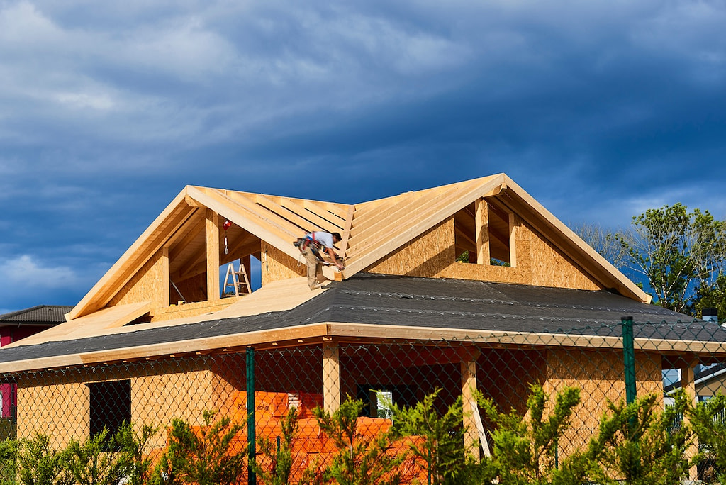 Roofer working on house
