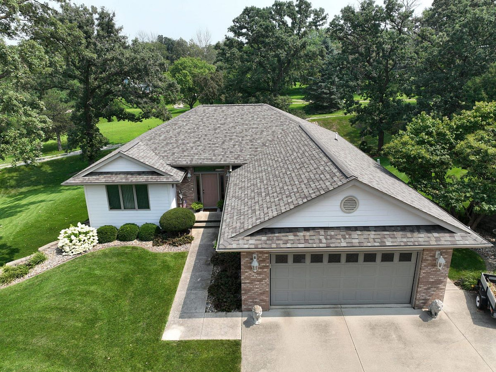 beautiful house with asphalt shingle roof