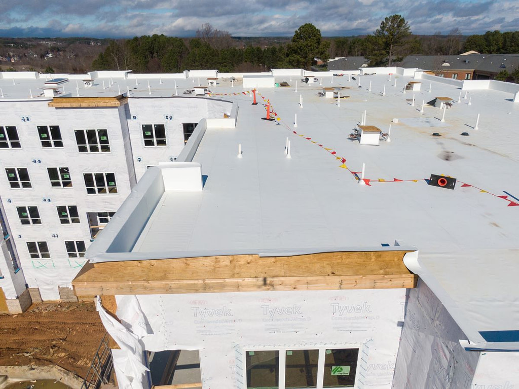 commercial flat roof being repaired