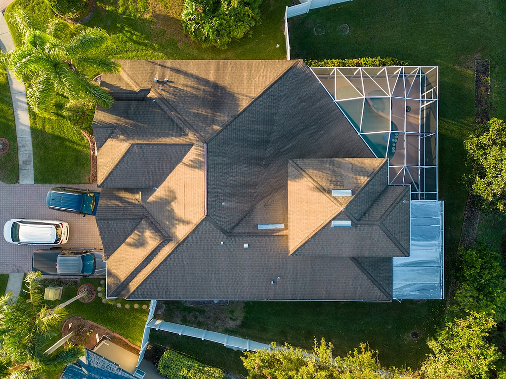 Top-Down view of Florida House with roof and screen enclosure from aerial uav drone