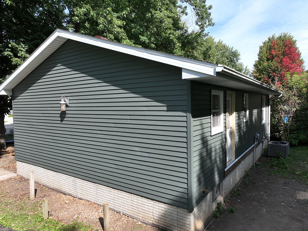 Newly installed grey vinyl siding