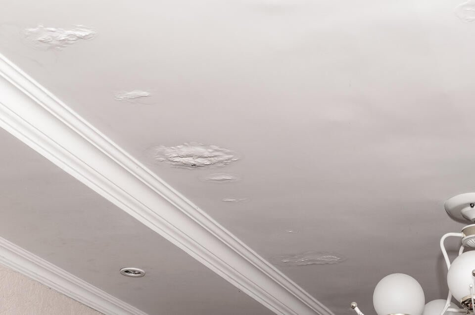 water leaking from ceiling-patches damaged materials along ceiling from water leak