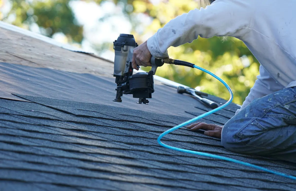 homeowner and nail gun