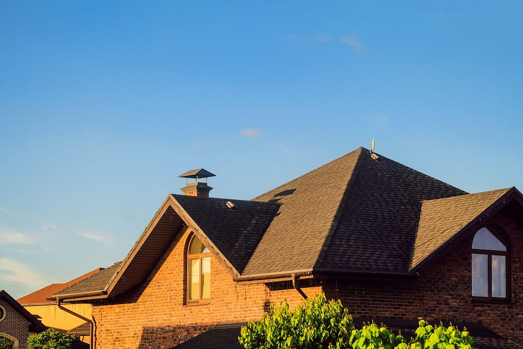 Pitched roof with soft sheathing. Valley roofing with attic window.