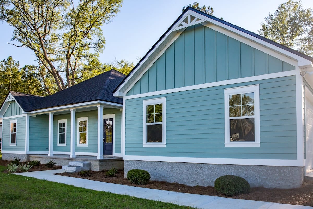 Vinyl siding teal color on residential home
