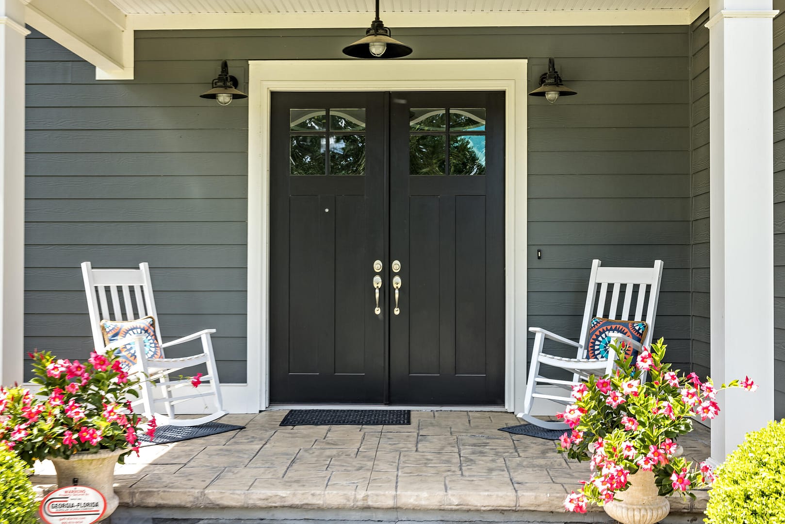 double front doors-black double front doors with silver hardware on grayish sided house