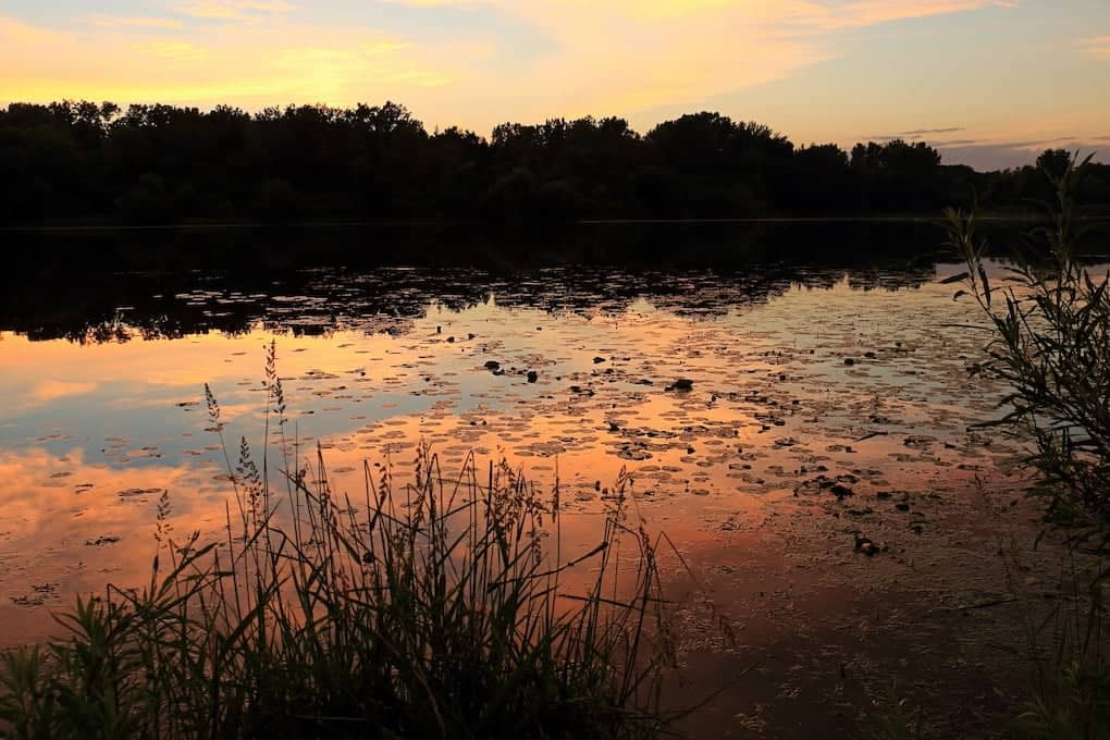 Sky Reflects off Theodore Wirth Lake at Sunset in best parks in Minneapolis