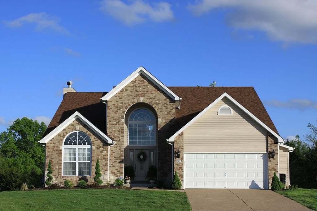 Country home with brown roofing material