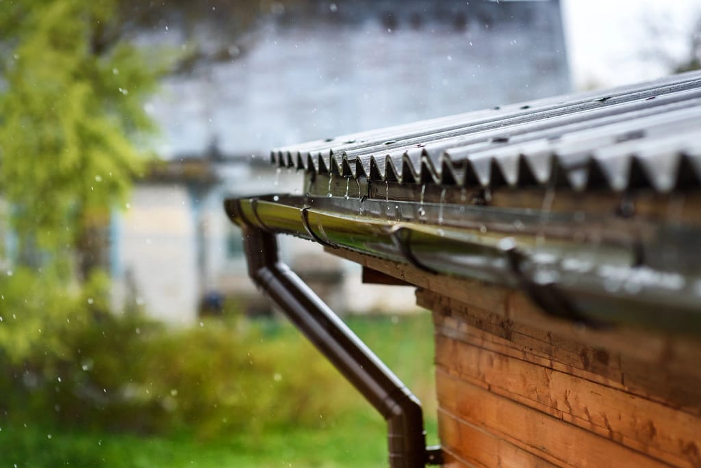close up of black metal roof and gutters system