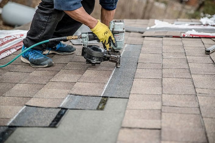 roof nail gun installing shingles