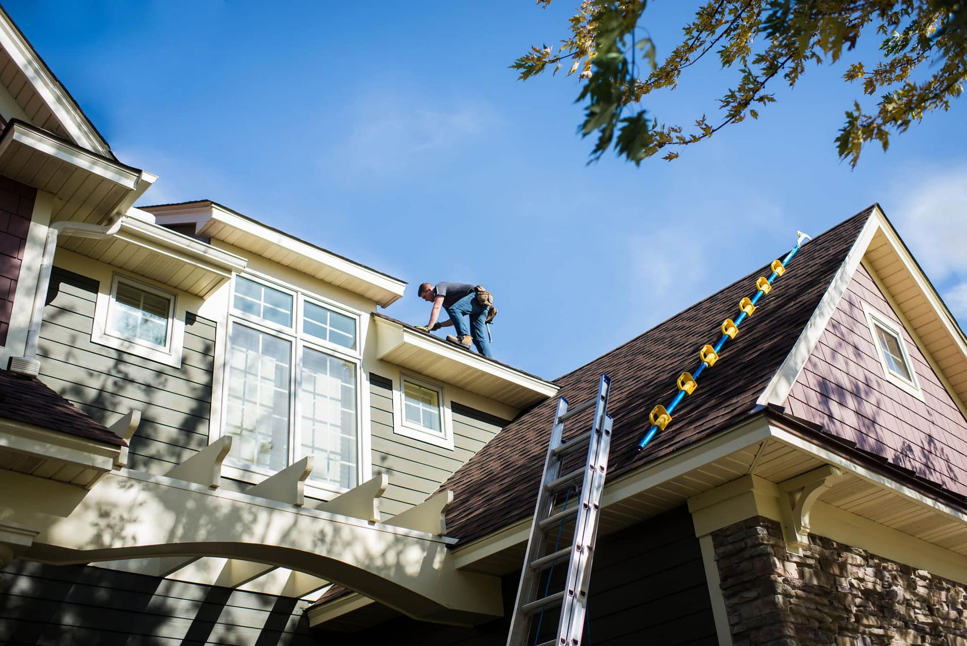 roofer working on installing siding with the best roof color