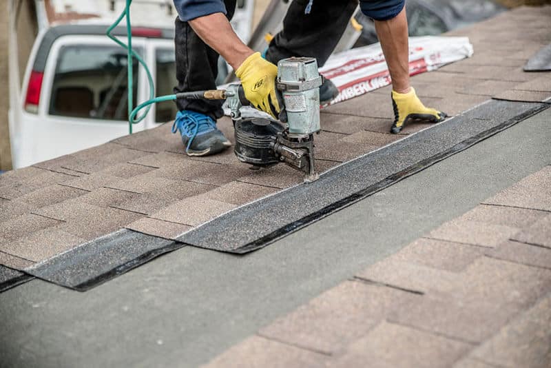 roof nail gun installing shingles