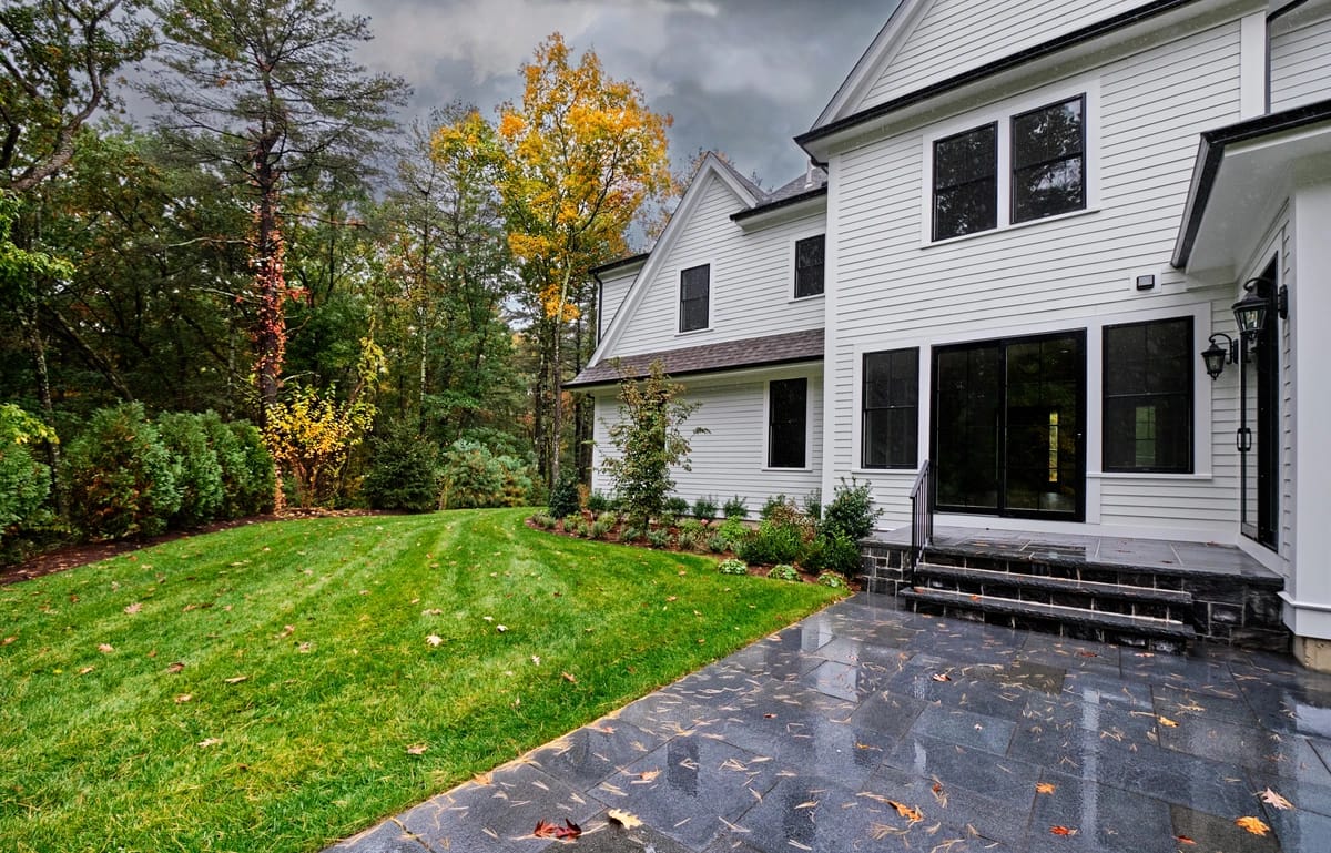 white house siding gets damaged during storm and needs repair