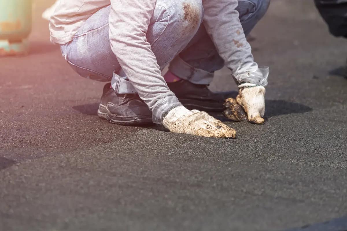installing flat roof material